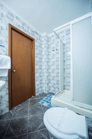 Фото номера Двухместный номер с 2 отдельными кроватями Отель Hotel Silva Busteni г. Буштени 14