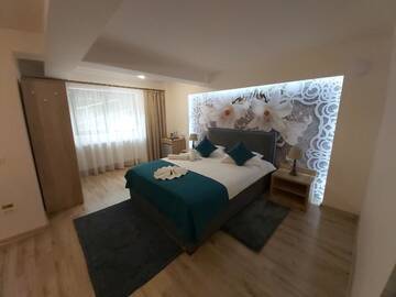 Фото номера Номер с кроватью размера «queen-size» - Первый этаж Гостевой дом CASA MALVINA г. Буштени 4